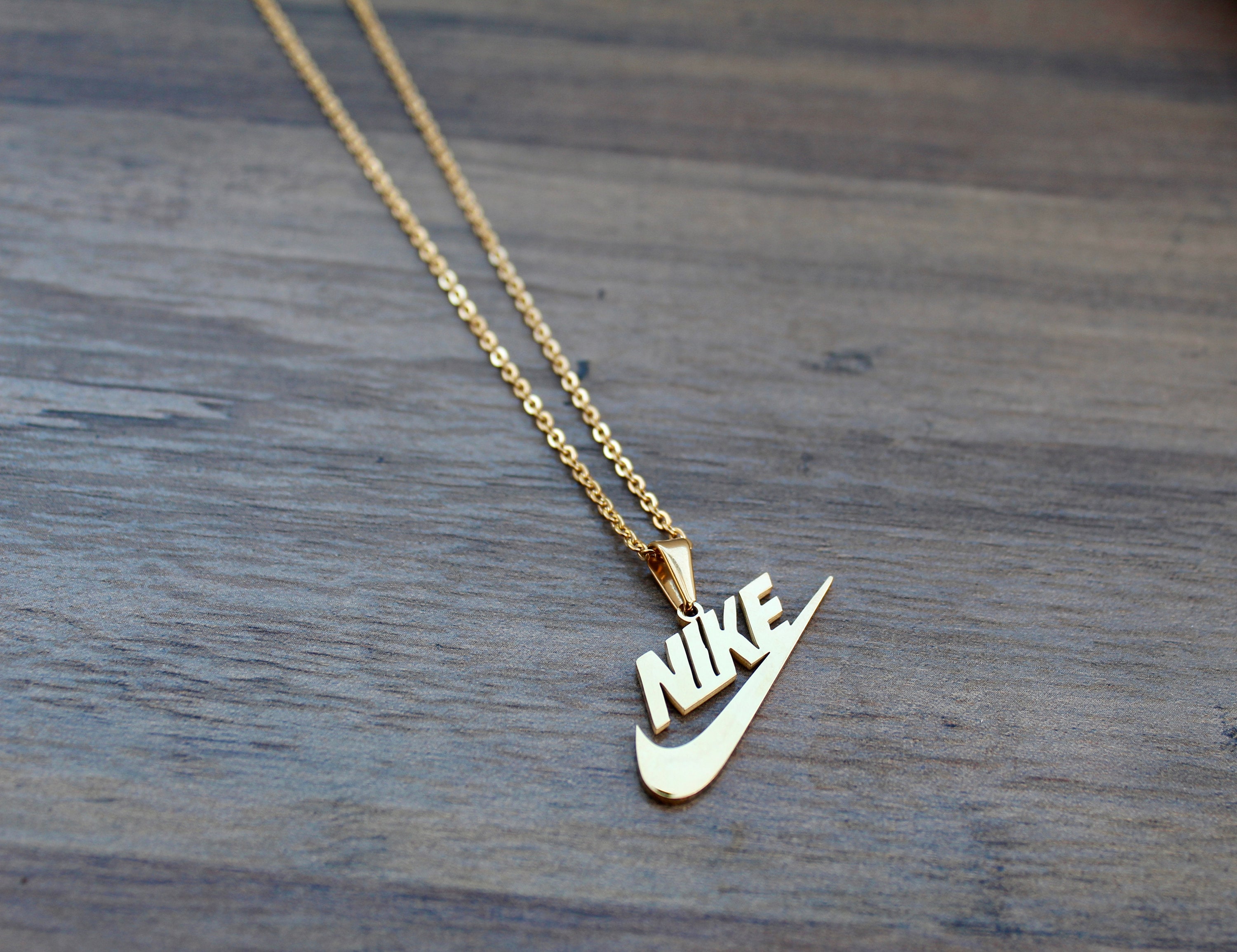 Real gold nike necklace deals