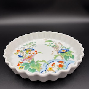 May include: A set of three ceramic mugs with a speckled, matte finish. The mugs are in shades of cream, light gray, and dark gray. Each mug has a simple, minimalist design, perfect for coffee or tea.