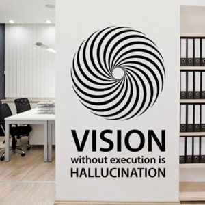 May include: A black and white wall decal featuring a spiral design and the text "VISION without execution is HALLUCINATION." The decal is applied to a white wall in an office setting.