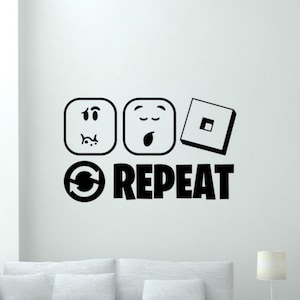 Op de afbeelding: Zwart-witte muursticker met drie emoji-achtige gezichten en een vierkant met een klein vierkant erin. Onder de gezichten staat een cirkelvormige pijl en het woord "REPEAT".