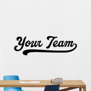 May include: Black and white vinyl wall decal with the text "Your Team" in a retro, cursive font.