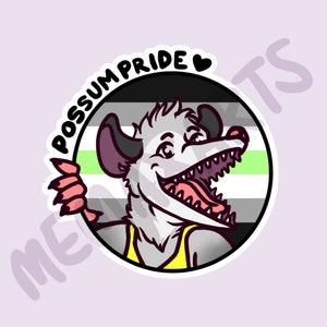 May include: A sticker featuring a cartoon possum with a big smile, wearing a yellow tank top. The possum is on a background of the asexual pride flag, with the text "Possum Pride" above it.