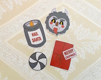 May include: Four Christmas-themed stickers featuring a candle with the text "Hail Santa", a peppermint candy, a red package with the text "Merry Creepmass", and a monster with a tongue sticking out.
