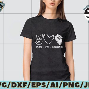 May include: A black t-shirt with a white peace sign, heart, and fist graphic. The text "Peace Love Juneteenth" is below the graphic. The shirt is available in black and white PNG.
