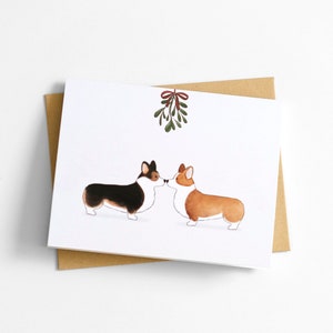 Bonita tarjeta de felicitación navideña con Corgi y muérdago navideño, Pembroke Welsh