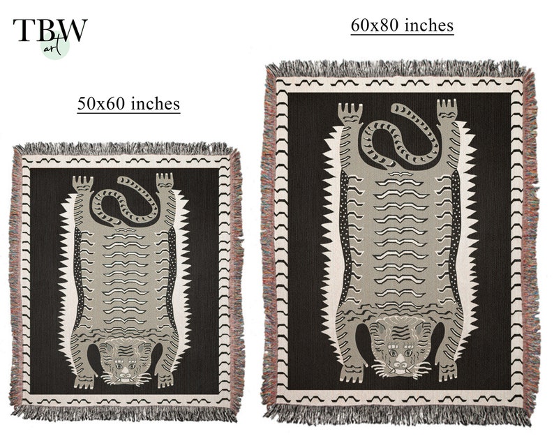 May include: Two woven tapestry throw blankets featuring a black and white tiger design. The smaller blanket is 50x60 inches and the larger blanket is 60x80 inches.