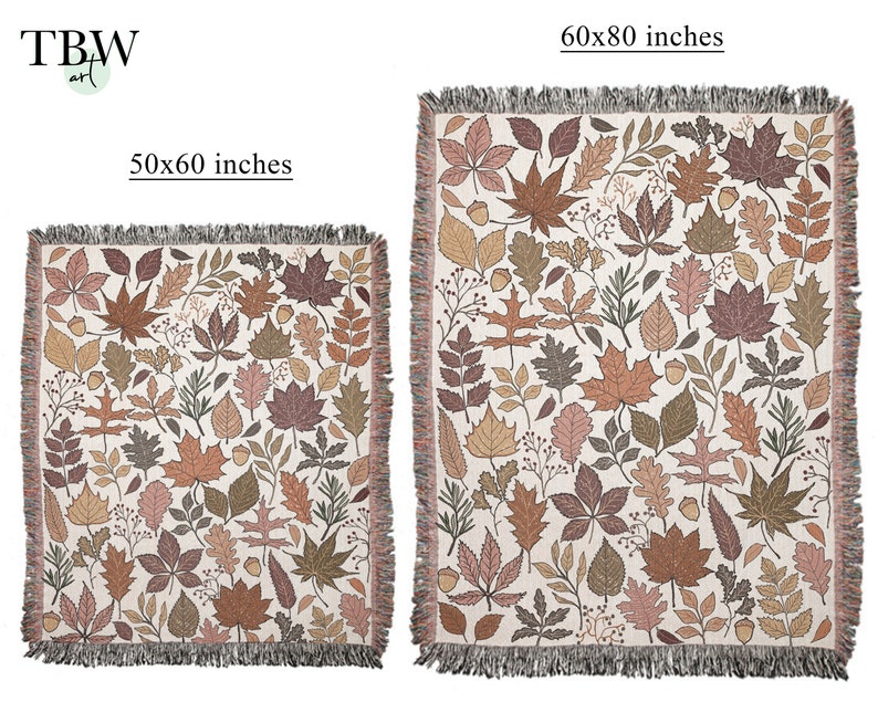 May include: Two woven throw blankets with a fall leaves pattern. The smaller blanket is 50x60 inches, and the larger one is 60x80 inches. The blankets feature a cream background with brown, orange, and green leaves and fringe.