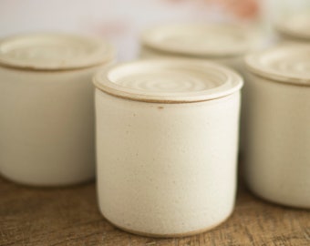 Handmade pottery storage jar with lid