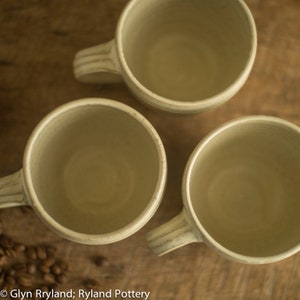 Handmade small pottery mug, a wide low mug in an off white satin glaze, coffee mug, image 3