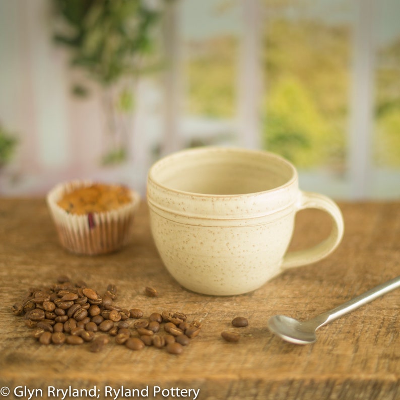 Handmade small pottery mug, a wide low mug in an off white satin glaze, coffee mug, image 1