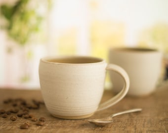 Handmade small pottery mug, a wide low mug in an off white satin glaze, coffee mug,