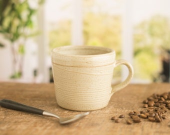 Handmade small pottery mug, a wide low mug in an off white satin glaze, coffee mug,