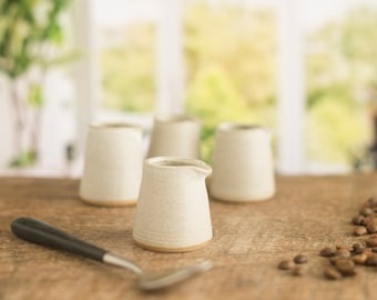 Tiny handmade pottery jug