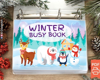 Può includere: Un raccoglitore blu e bianco con il testo "WINTER BUSY BOOK" sulla copertina. La copertina presenta un cervo, un orso polare, un pinguino e un pupazzo di neve in un paesaggio invernale.