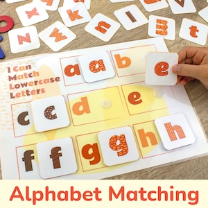 May include: A printable alphabet matching game for children. The game features lowercase letters with orange and brown patterns on white cards. The title of the game is "I Can Match Lowercase Letters".