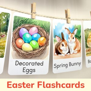 May include: A set of Easter flashcards featuring a lamb, decorated eggs in a nest, a pair of spring bunnies, and baby chicks. The flashcards are printed on white cardstock and have a watercolor style.