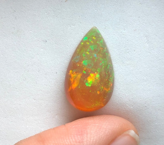 Green and 2024 orange gemstone