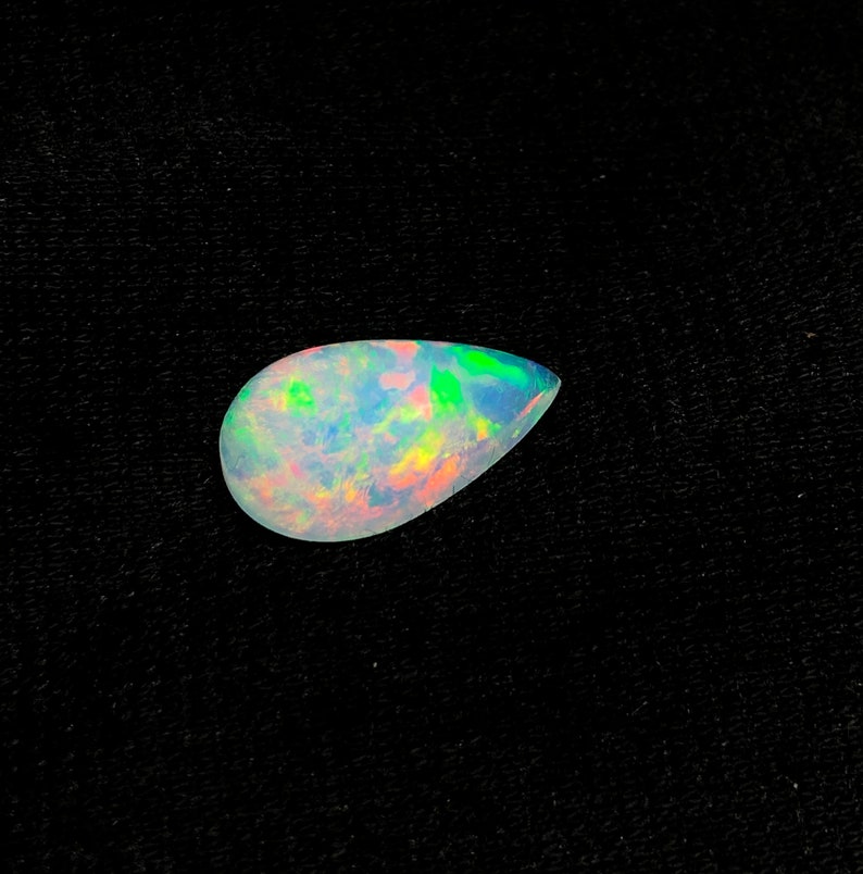 Ethiopian Blue Opal Stone full Fire Play Of Colors Opal Cabochon Stone Natural Pear 2.81 Carats Top Quality AAA Grade Opal Gemstone