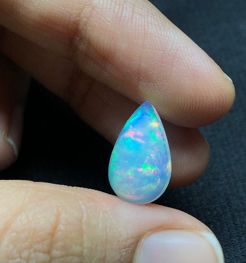 Ethiopian Blue Opal Stone full Fire Play Of Colors Opal Cabochon Stone Natural Pear 2.81 Carats Top Quality AAA Grade Opal Gemstone