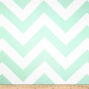 May include: A white and mint green chevron pattern fabric. The fabric has a subtle texture and is perfect for crafting projects.