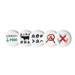 May include: Five circular white pinback buttons featuring distinct graphic designs. The first shows green text and symbols, the second a black silhouette of a hippopotamus with symbols, the third black abstract symbols, the fourth a red and black magnifying glass, and the fifth a red X over two crossed dollar-patterned bars.