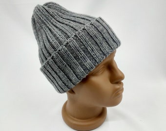 May include: A gray knitted beanie with a ribbed texture.