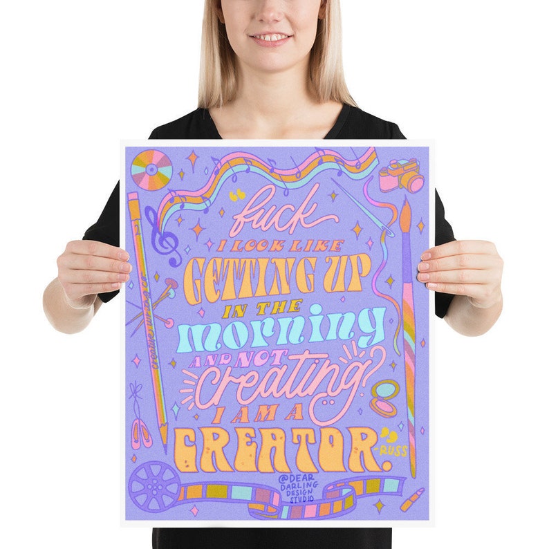 May include: Purple background with a colourful graphic design that says "F*ck I look like getting up in the morning and not creating? I am a creator." with a film reel and other design elements.