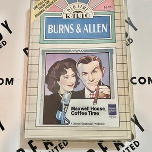 May include: A vintage "Burns & Allen" radio show cassette tape. The cover features a color image of the comedy duo, with the text "Maxwell House Coffee Time." The tape is in a clear plastic case.
