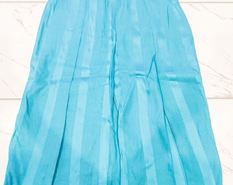 May include: A turquoise skirt with vertical stripes. The skirt has a waistband and pleats.