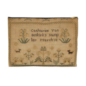 May include: A beige sampler with a black zipper at the top. The sampler is embroidered with a floral design and the text "Catharine Van Boskirks sampler March 18".