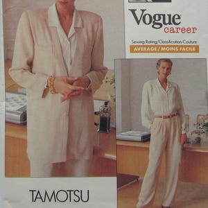 May include: A vintage Vogue career sewing pattern featuring a woman in a light-colored pantsuit. The pattern cover includes the text "Vogue career" and "TAMOTSU". The sewing rating is "AVERAGE / MOINS FACILE".