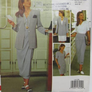 May include: Vogue career wardrobe pattern featuring a gray suit with a blazer, skirt, and shorts. The pattern includes sizes 6-8-10. The design is by Tamotsu, a Vogue American Designer. The image shows different outfit variations.
