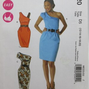 May include: McCall's sewing pattern M6320 featuring illustrations of three different one-shoulder dresses. The pattern includes a size range of D5 (12-14-16-18-20). The cover has the word "EASY" in a pink circle.