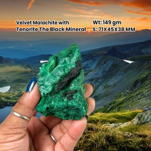 May include: A striking green Velvet Malachite mineral with black Tenorite. The stone weighs 149 grams and measures approximately 7.1 x 4.5 x 3.8 cm. The image text reads "Velvet Malachite with Tenorite The Black Mineral".