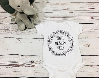 Download Free White Onesie Mockup Onesie Mockup Rabbit Skins Mockup Real Photo Mockup Mockup Cute Onesie Mock Up Mockup Graphics Designs Templates PSD Mockup Template