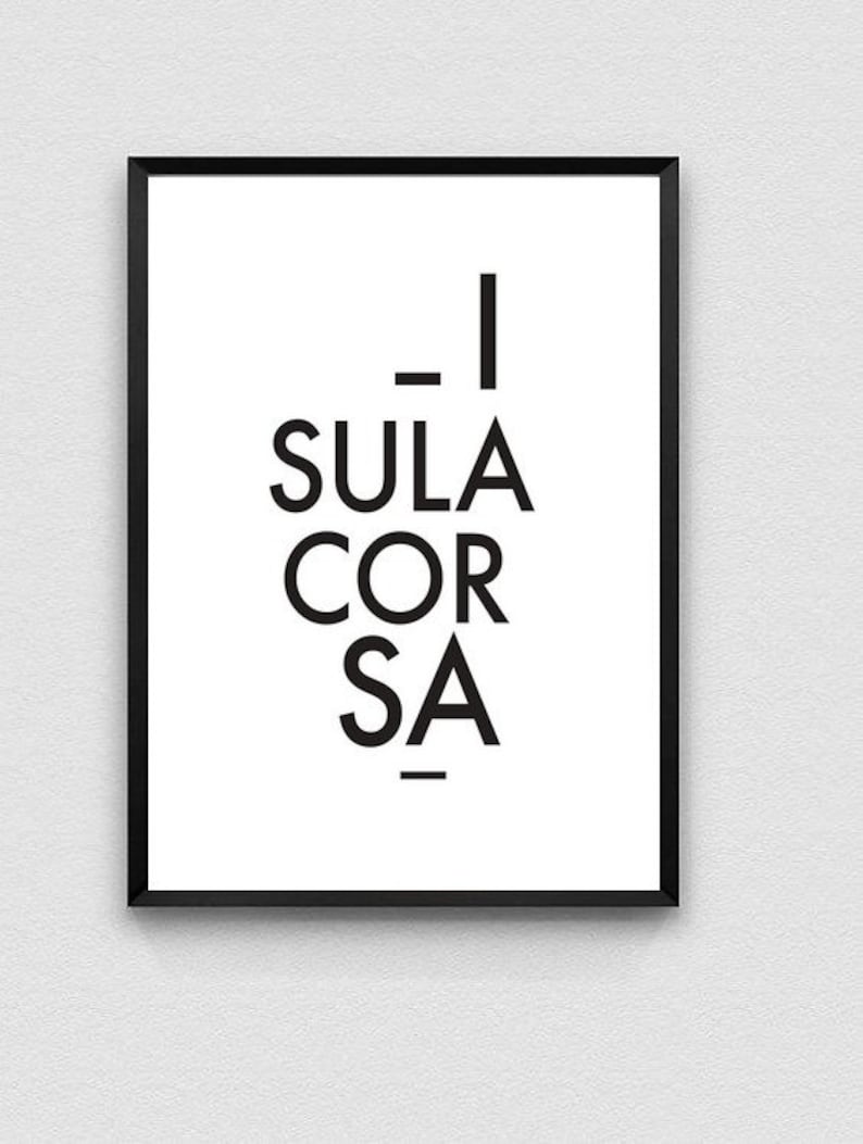 May include: A framed art print with the words "_I SULA COR SA_" in bold, black sans-serif font on a white background. The artwork is encased in a black frame, creating a minimalist aesthetic.