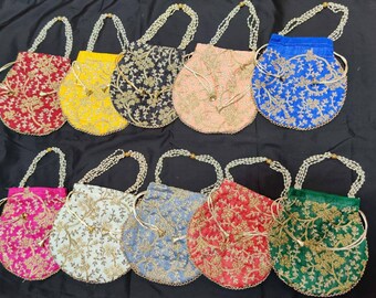 May include: Ten embroidered drawstring pouches with pearl handles. The pouches are in various colors, including red, yellow, blue, pink, green, and white. Each pouch has a floral design with gold embroidery.