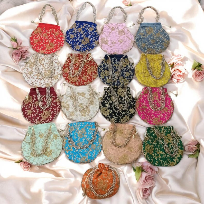 May include: Assortment of 17 small, round, drawstring bags with beaded handles. The bags are made of various fabrics and feature embroidered floral designs in a variety of colours, including red, blue, pink, yellow, green, and gold.