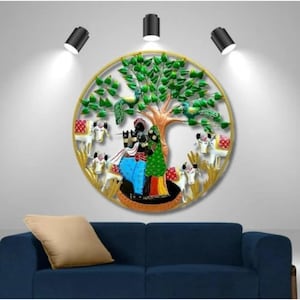 May include: A circular metal wall art piece depicting a colorful scene of a couple standing under a green tree with peacocks, surrounded by white cows. The artwork is framed in gold and has a rustic, folk art style.