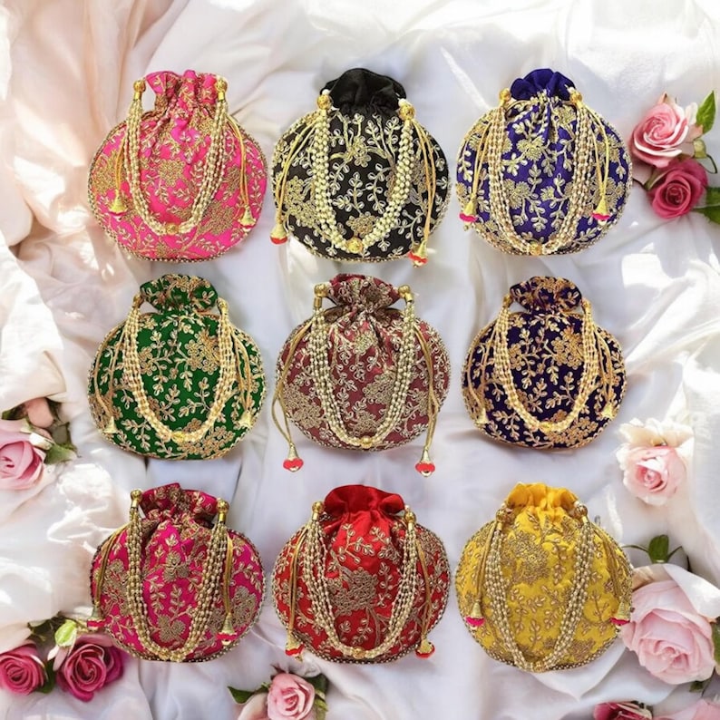 May include: Nine embroidered drawstring bags in a variety of colours, including pink, green, red, black, and gold. The bags are round and feature intricate floral designs.