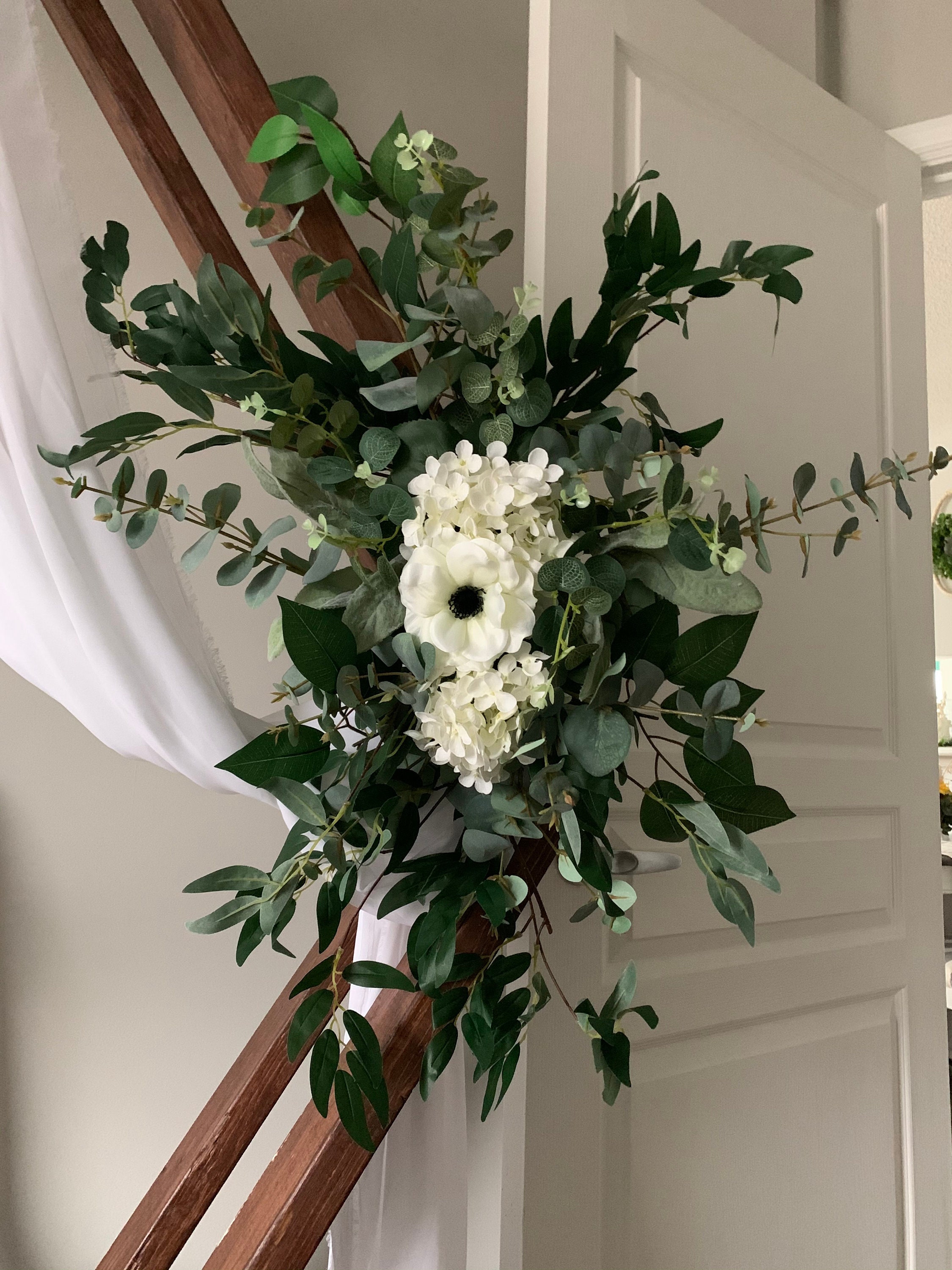 Greenery swag & tieback for wedding arch with anemones, hydrangeas
