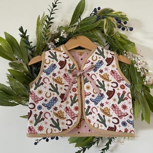 Children Quilted Vest/Tie Front Reversible girls Vest made out of cotton poplin in a fun Cowgirl print