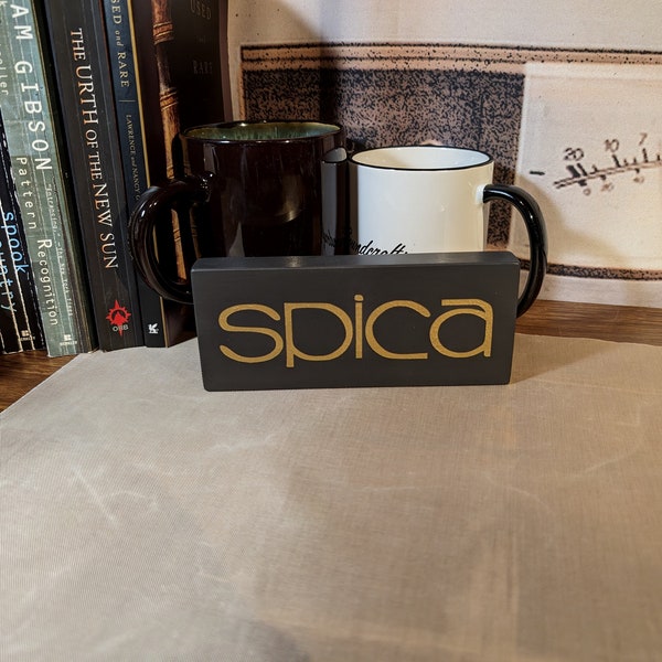 Spica speakers - painted wood sign, gold on dark gray 2.5" x 6" x .75"