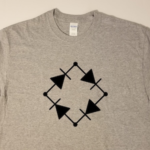 May include: A heather gray t-shirt featuring a black graphic of a bridge rectifier circuit symbol. The design is centered on the chest. The shirt is made of a soft, comfortable material.