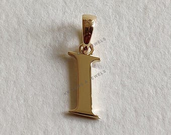 May include: Gold-toned pendant charm in the shape of the letter I. The pendant has a bail at the top for attaching to a chain or necklace.
