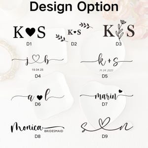 May include: White ceramic dishes with black text and designs. The dishes feature initials, names, and dates, with heart and floral accents. The text "Design Option" is at the top.
