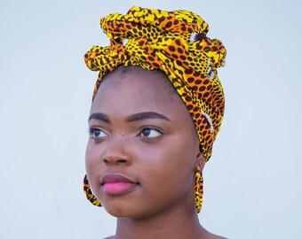 African print head wrap and large disc earrings set in an orange geometric vintage print.