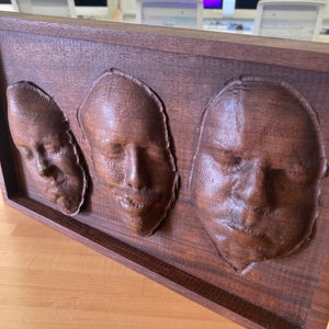 Faces Carved In Wood