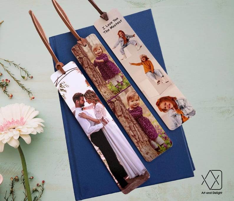 May include: Three photo bookmarks with brown leather straps. The bookmarks feature different photos of people and the text "I Love You The Mostest".