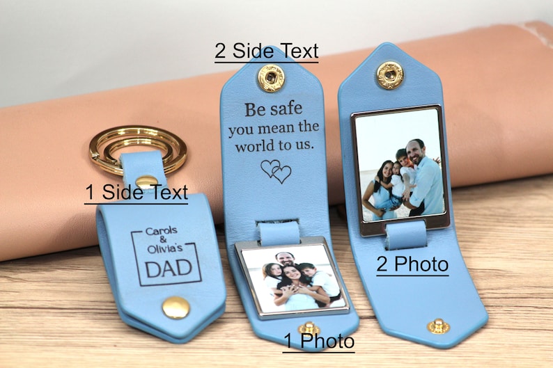 May include: Light blue leather keychain with a gold-colored ring. The keychain has a rectangular photo frame and the text "Be safe you mean the world to us." The other side says "Carols & Olivia's DAD".